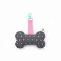 Handmade bone-shaped dog toy keychain, dark grey fabric with white stars, pink strap and teal clip