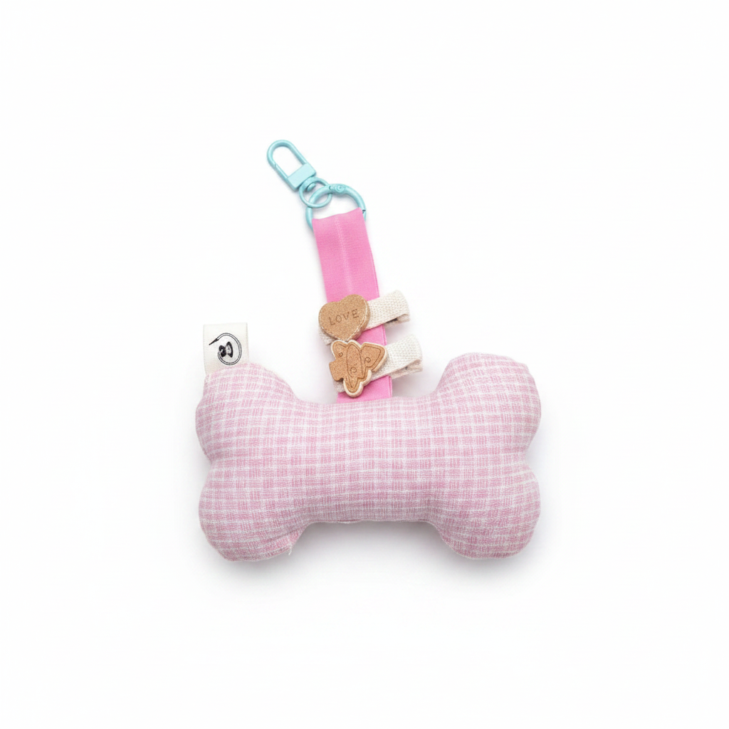 Handmade bone-shaped dog toy keychain, light pink grid fabric with butterfly charm, pink strap and teal clip