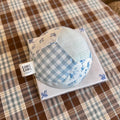 Kang Kang Handmade Patchwork Dog Ball on white tile display showing blue gingham, floral and stripe patchwork panels