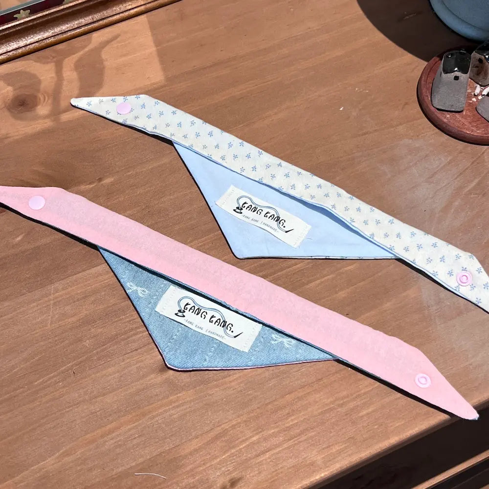 Kang Kang handmade dog triangle scarf set of 3 displayed together, showing pink denim, floral blue, and polka dot styles