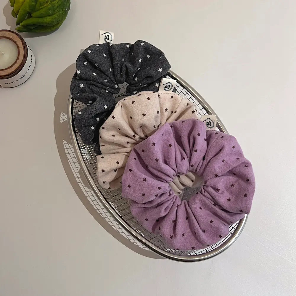 Kang Kang Handmade Softie Collection – autumn new arrivals, handmade star print scrunchies in dark grey, beige, and lavender purple, styled flat lay